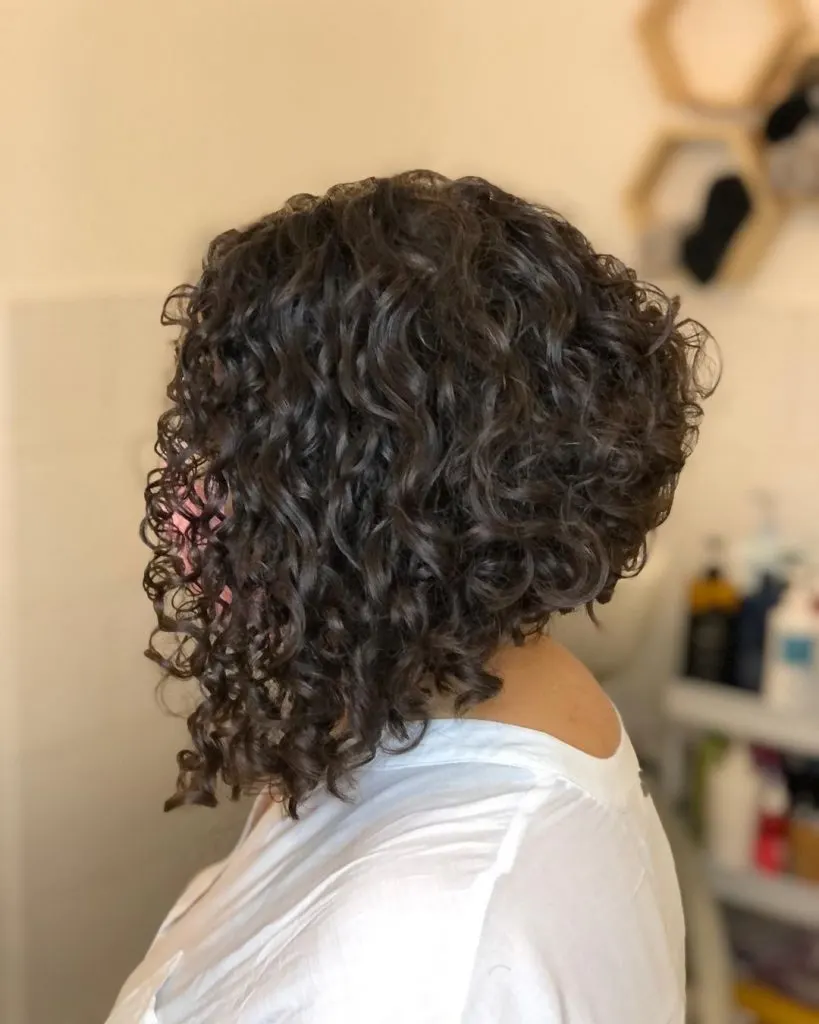 angled curly stacked bob