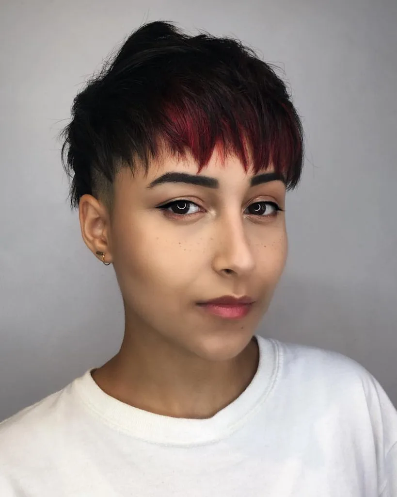 black pixie cut with fiery red bangs