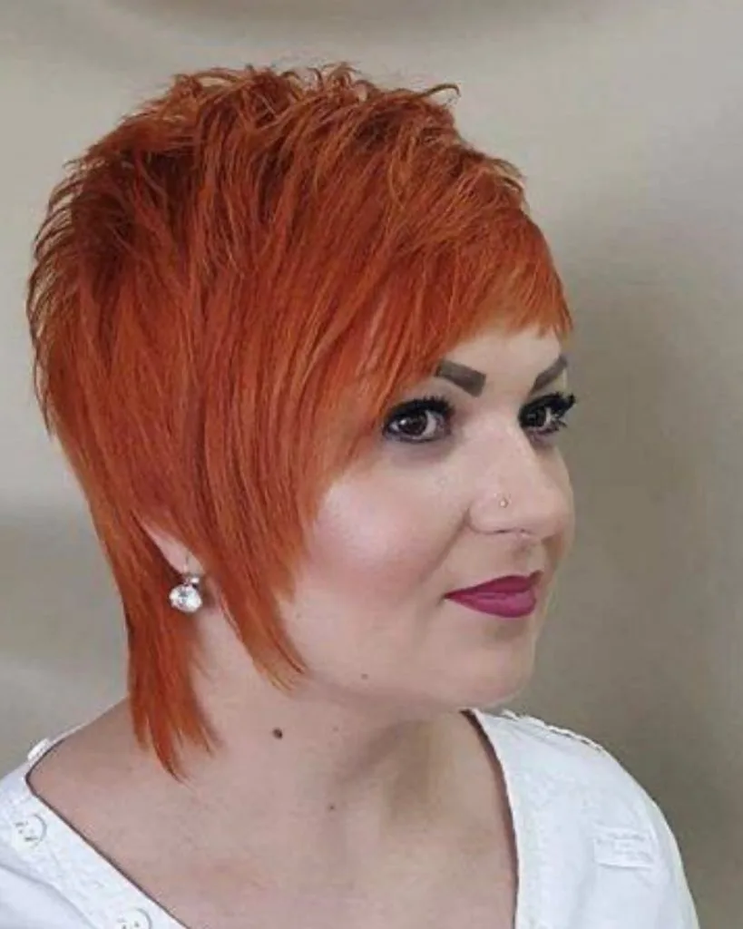 copper red pixie cut with long bangs