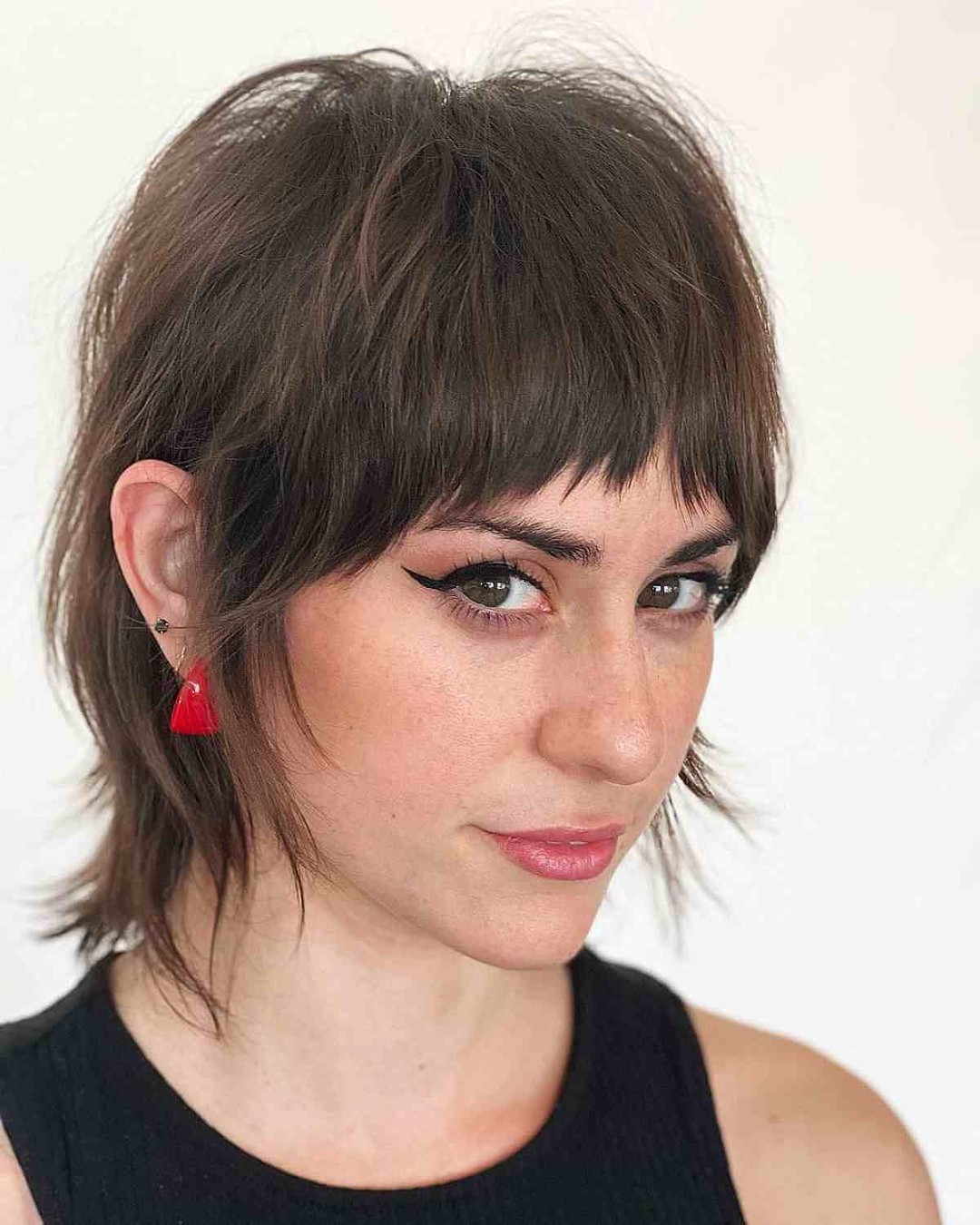 choppy layered haircut with razored bangs