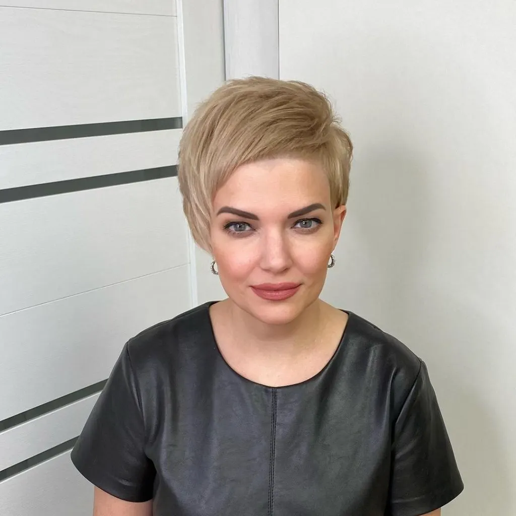 blonde pixie cut with baby bangs