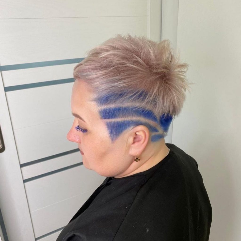 blonde pixie cut with blue fades