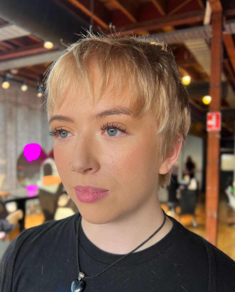 blonde pixie cut with shaggy bangs