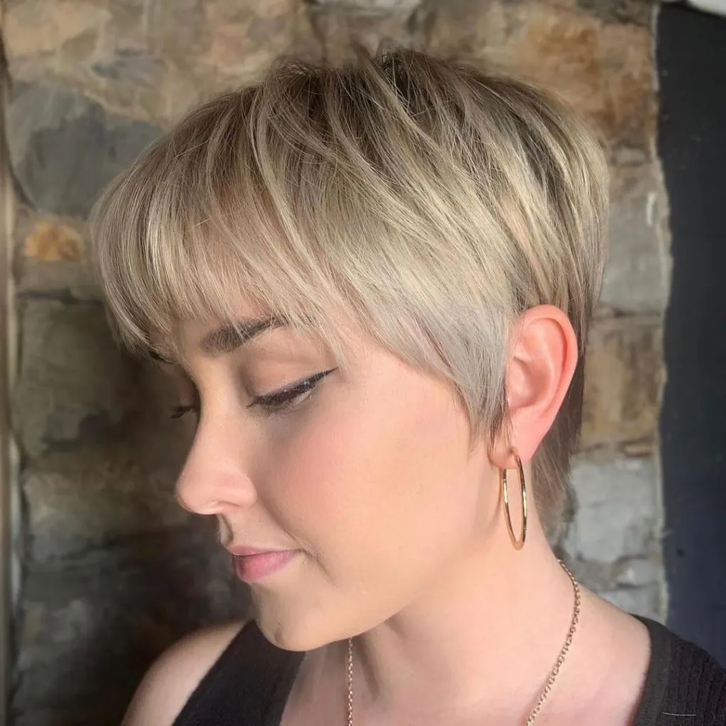 blonde pixie cut with sideburns