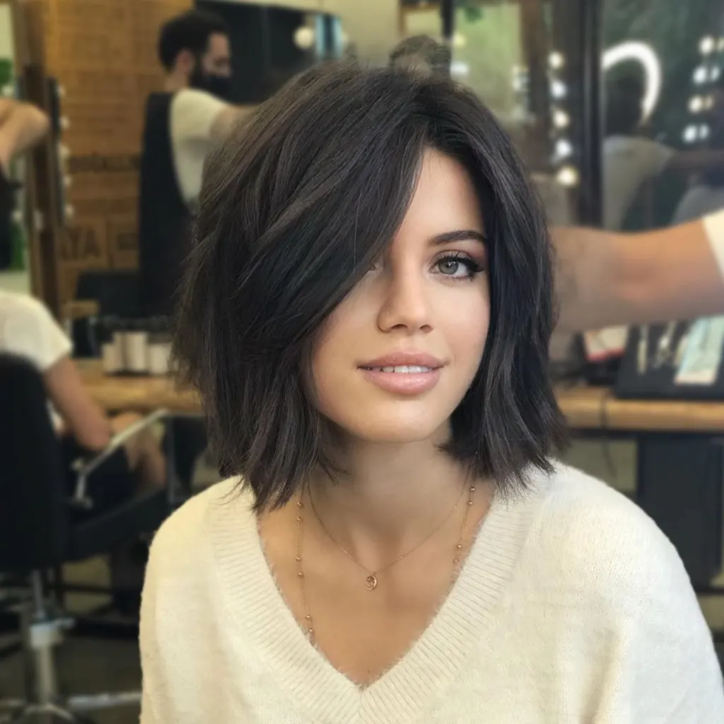 blunt cut bob with side bangs for thick hair
