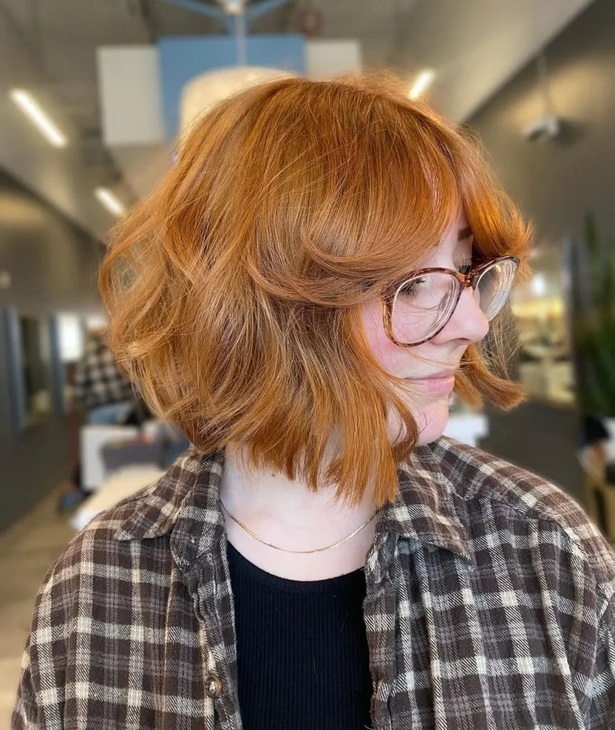 curly bob with curtain bangs
