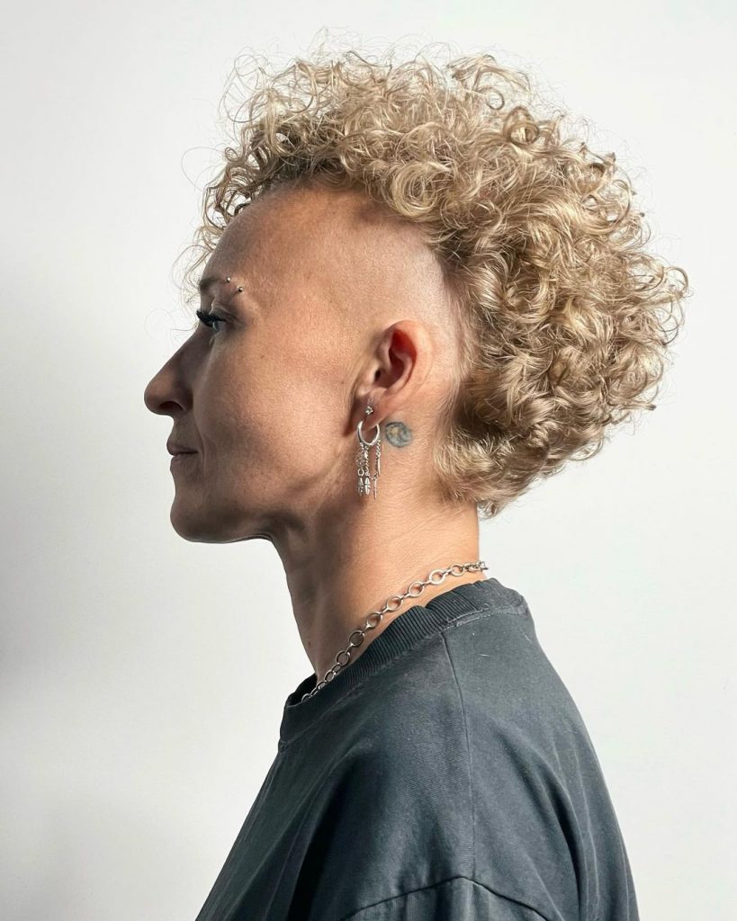 edgy curly blonde pixie with shaves sides