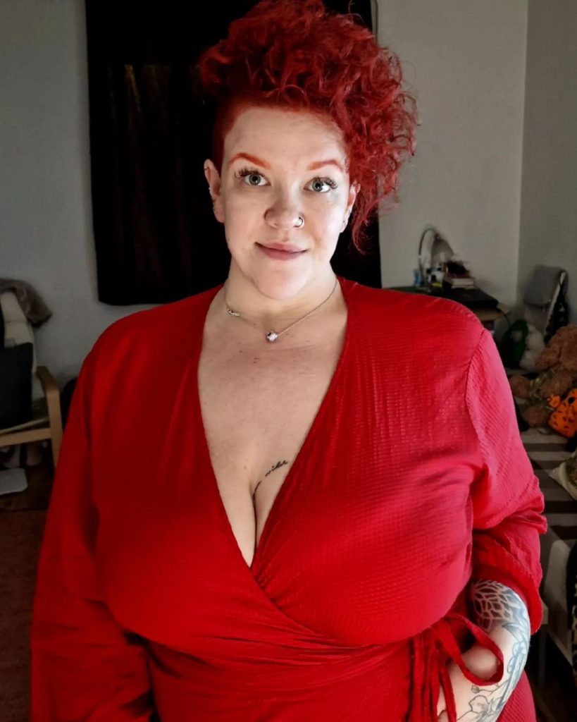 edgy red asymmetrical curly pixie cut