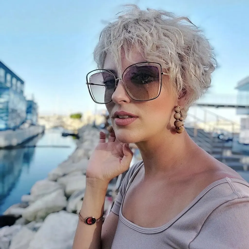 ice blonde curly pixie cut
