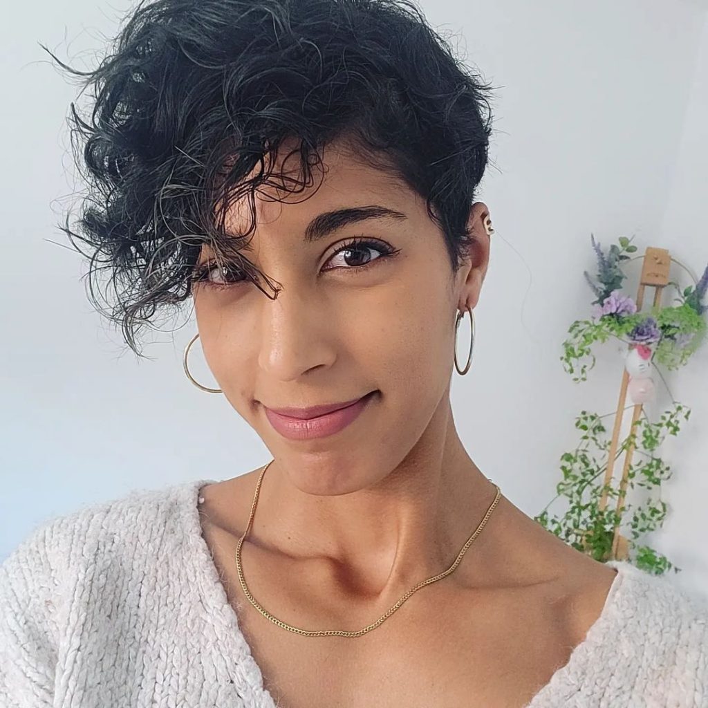 short pixie cut with long curly bangs