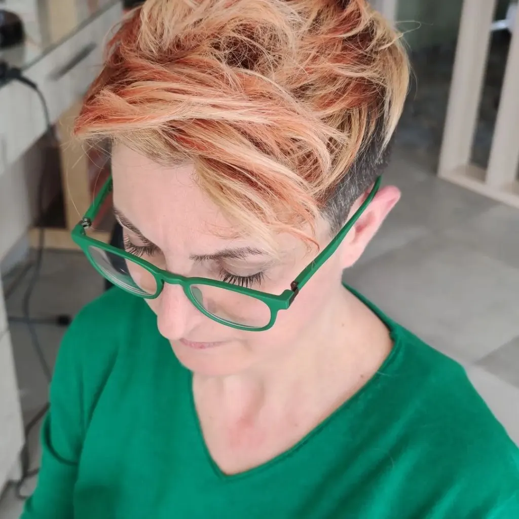 strawberry blonde pixie with black undercut