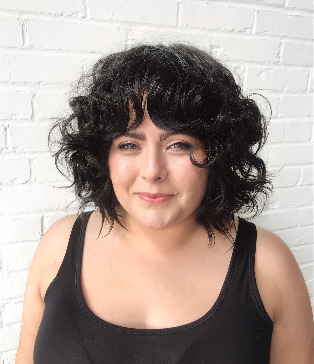 curly hair with curtain bangs hairstyle