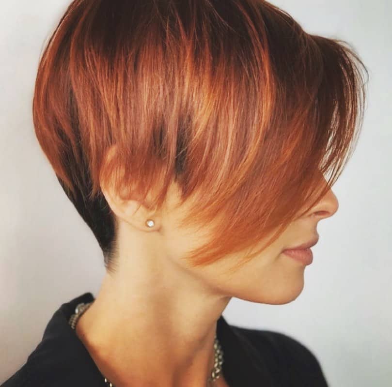 asymmetrical pixie cut with red highlights