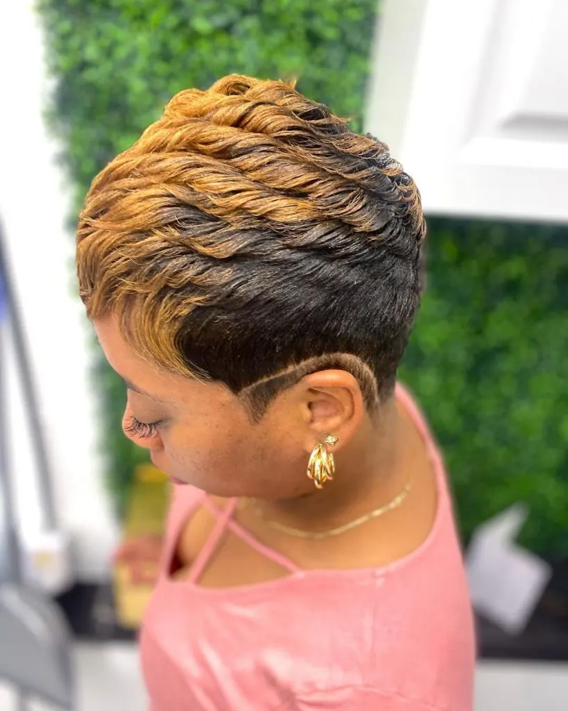 black and blonde curly pixie cut