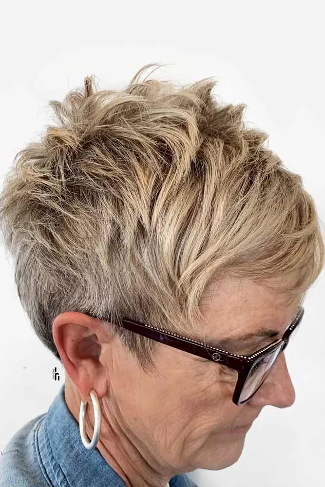 blonde layered pixie cut for older women with glasses