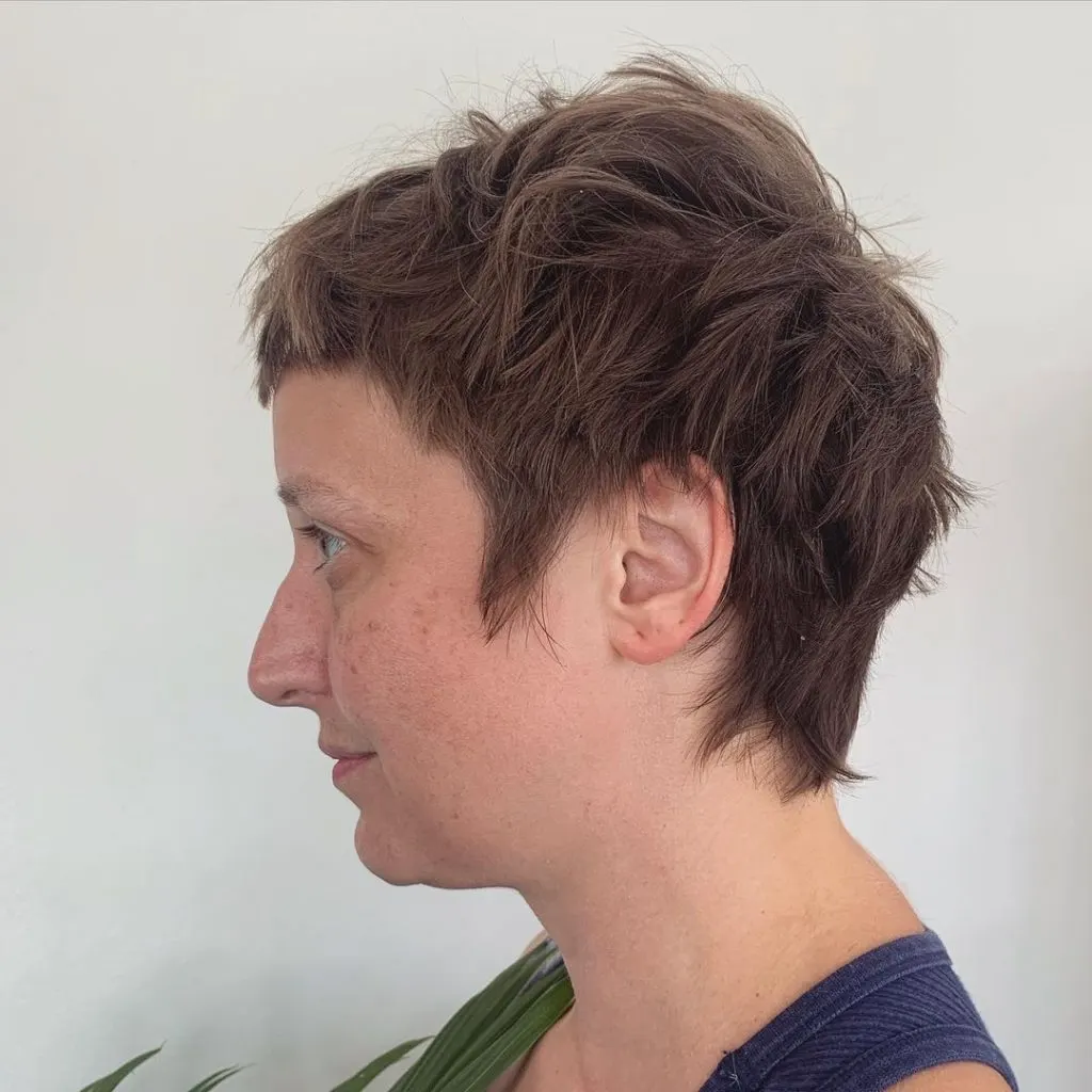 choppy pixie cut with long sideburns
