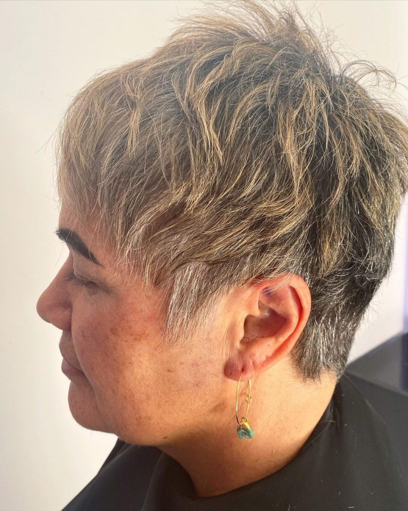 choppy pixie cut with natural gray highlights