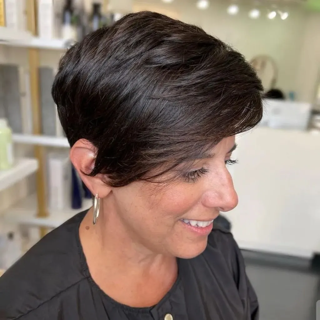 dark pixie cut with long bangs