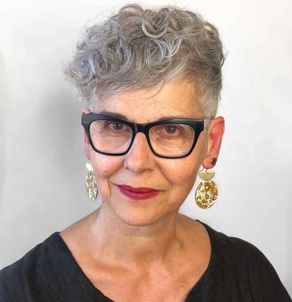 elegant curly pixie for older ladies with glasses