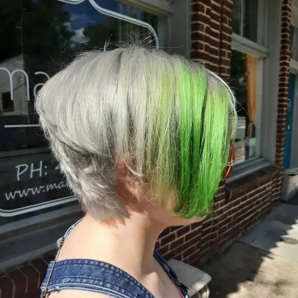 gray pixie cut with long green bangs