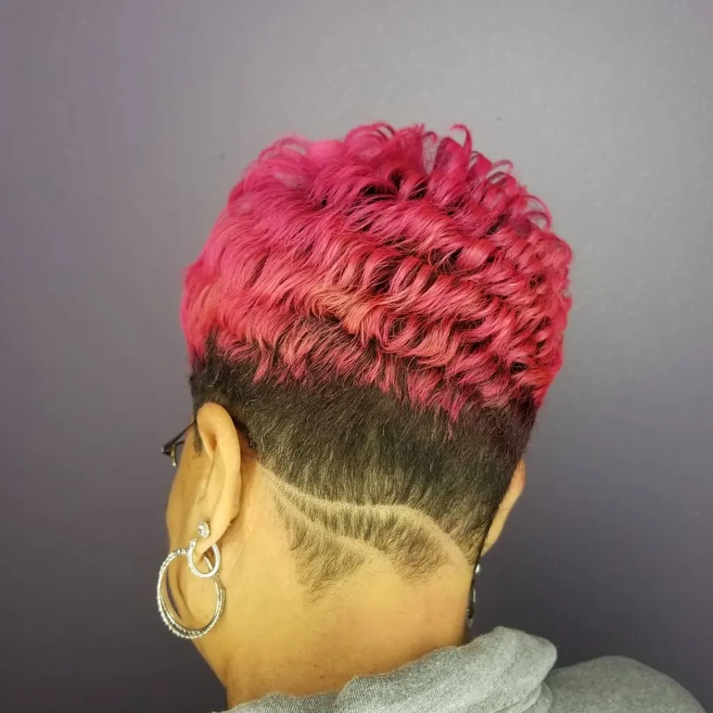 pink pixie cut with spiral curls and undercut