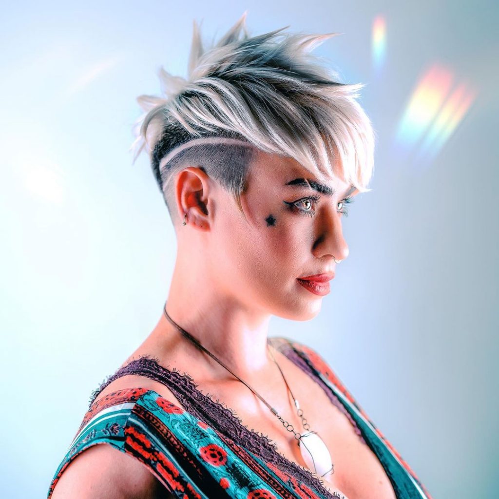 short edgy pixie cut with long strands of bangs