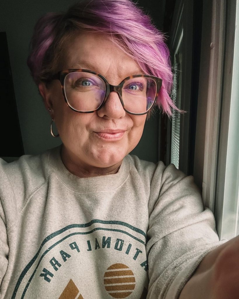 violet pink pixie cut for older ladies with glasses