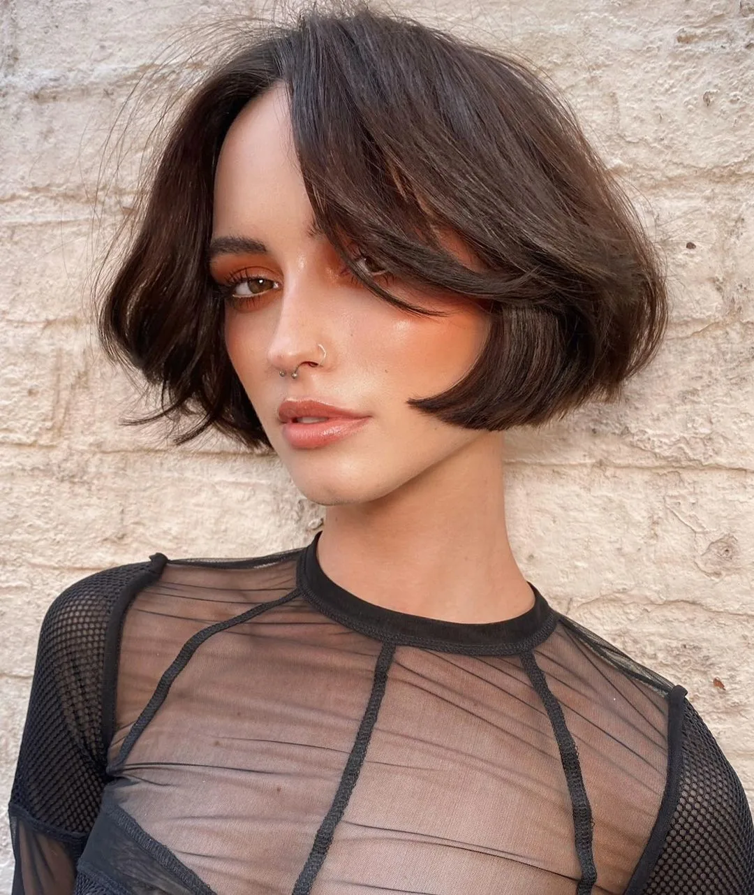 5. Chin Length Layered Bob Cut .webp