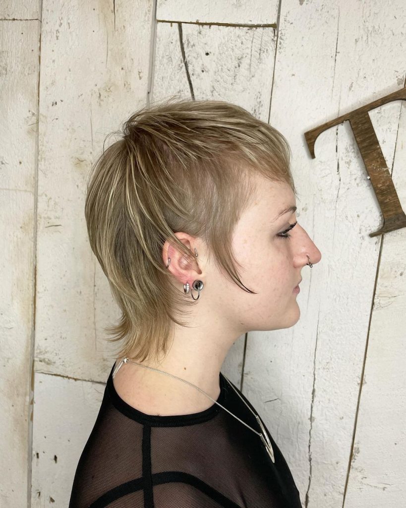 edgy short hairstyle for fine hair with long sideburns