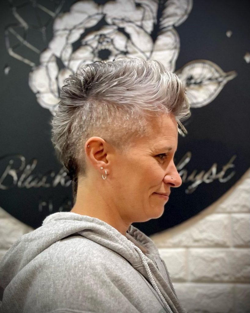 gray mohawk with shaved sides for round faces