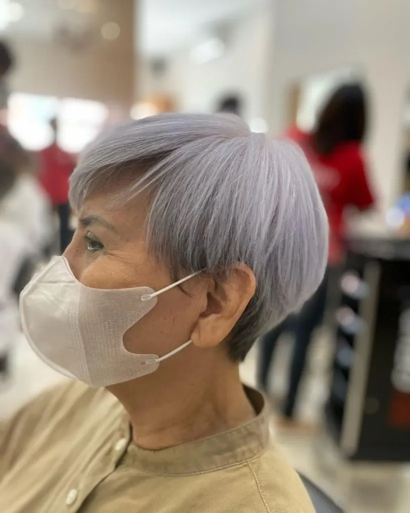 gray pixie cut with dark roots for older women