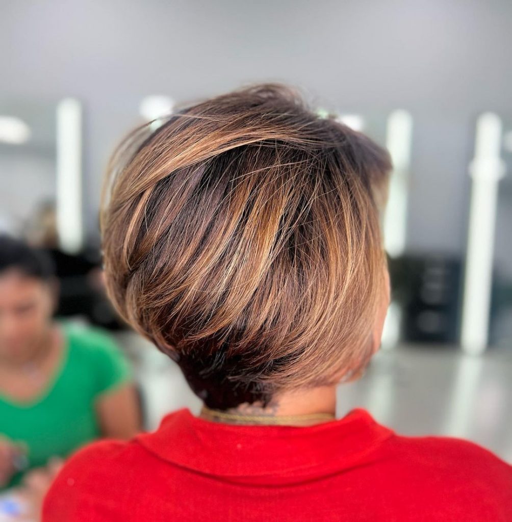 long pixie haircut for thick hair with caramel highlights