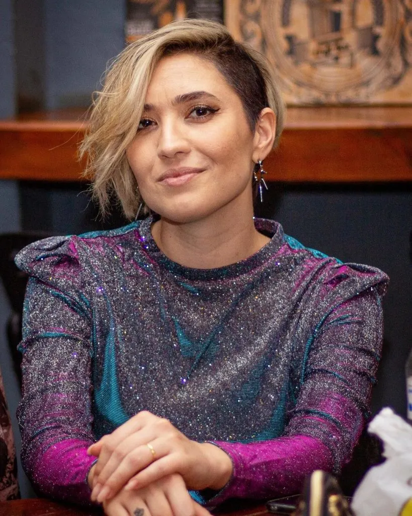 pixie cut with extra long bangs and shaved sides