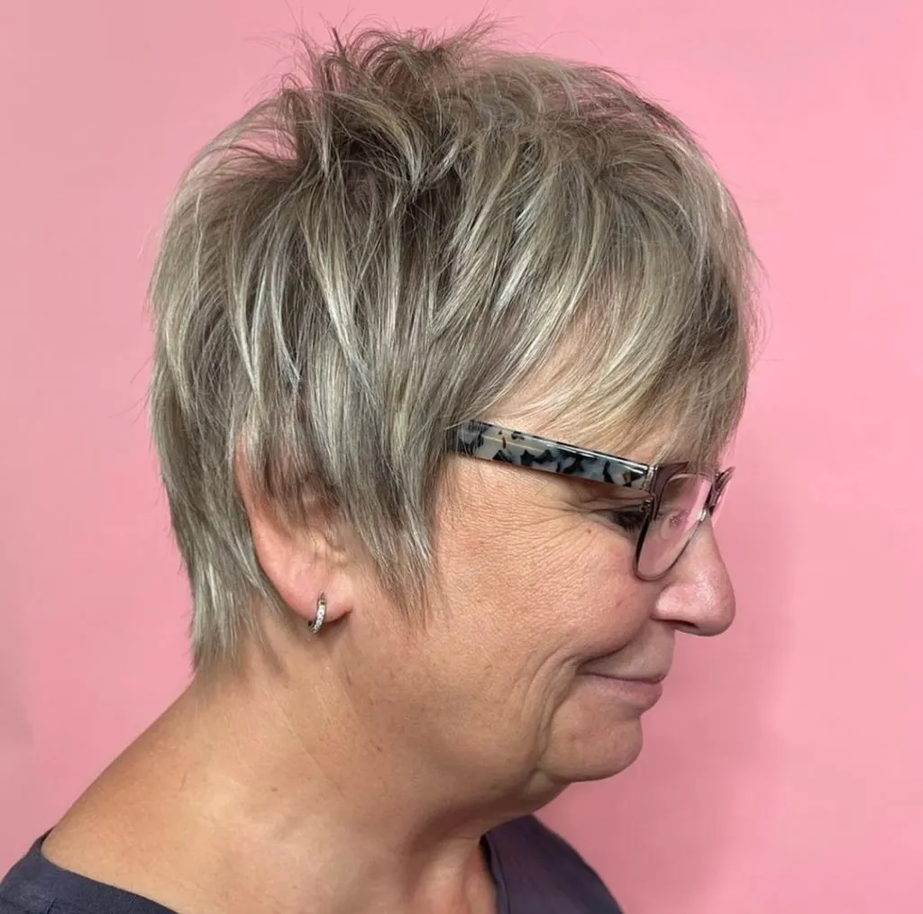 short gray haircut with long sideburns for older women