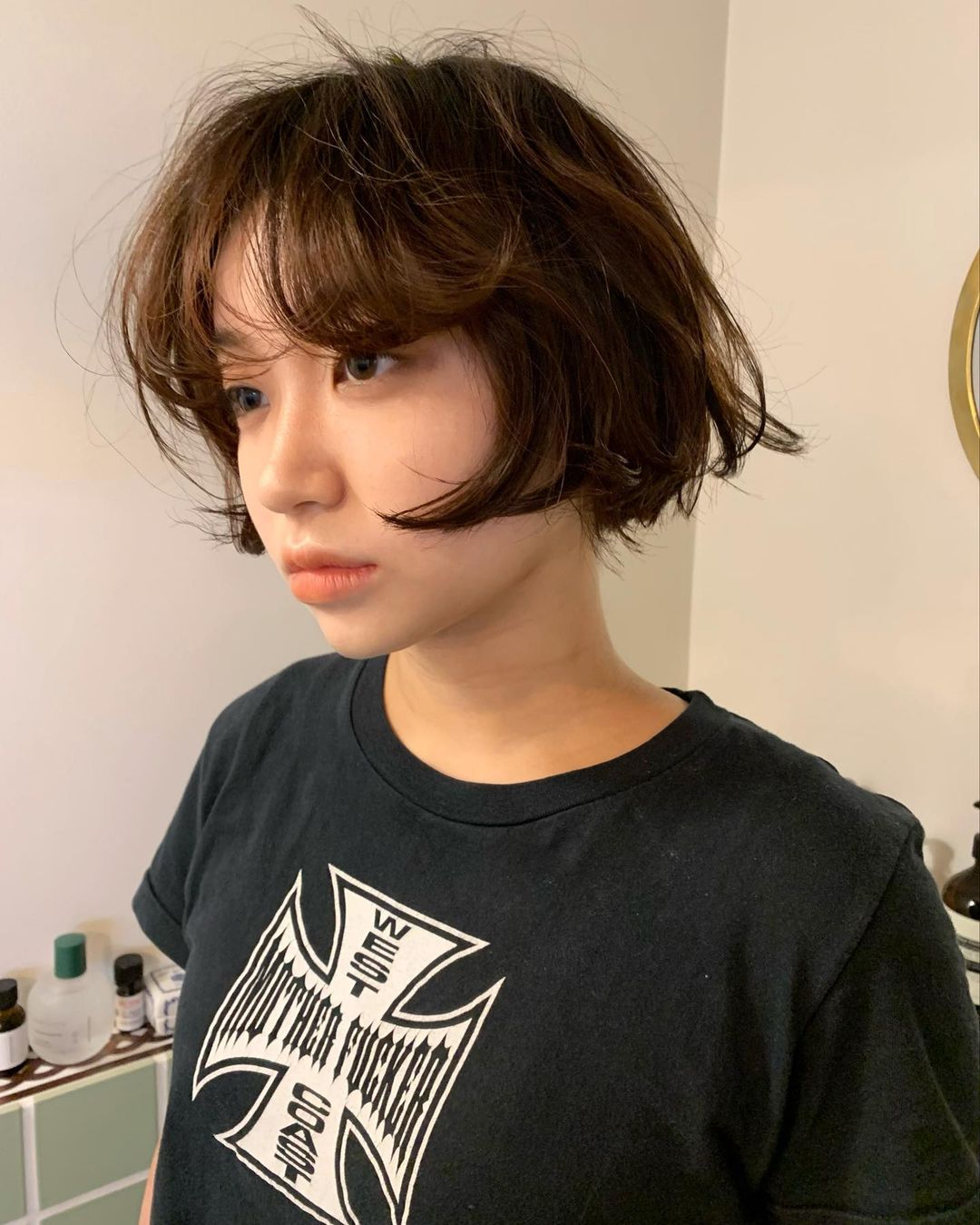round face and a tousled french bob