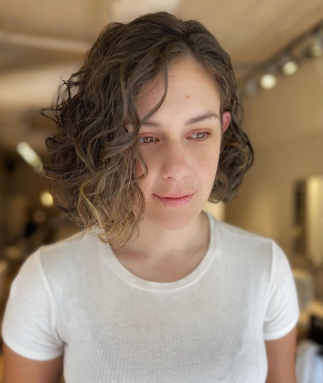 asymmetrical curly bob