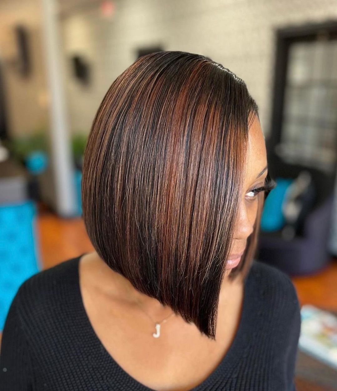 asymmetrical deep side part bob