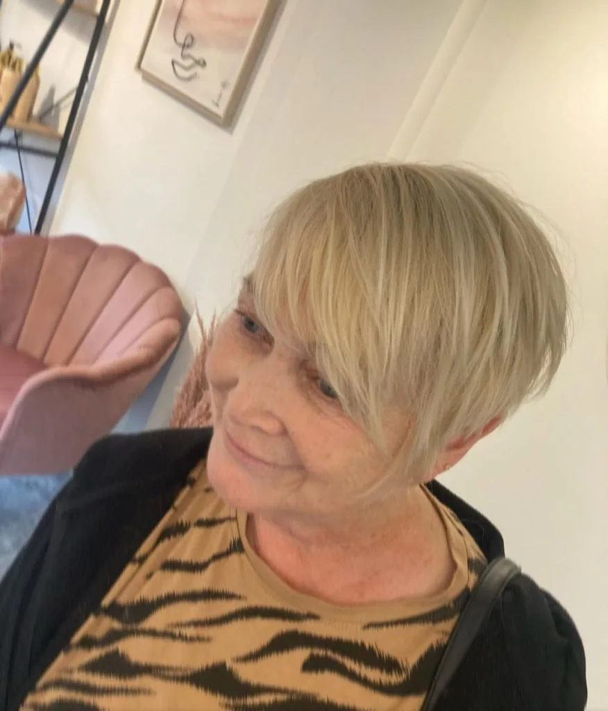 blonde asymmetrical short haircut for women over 60