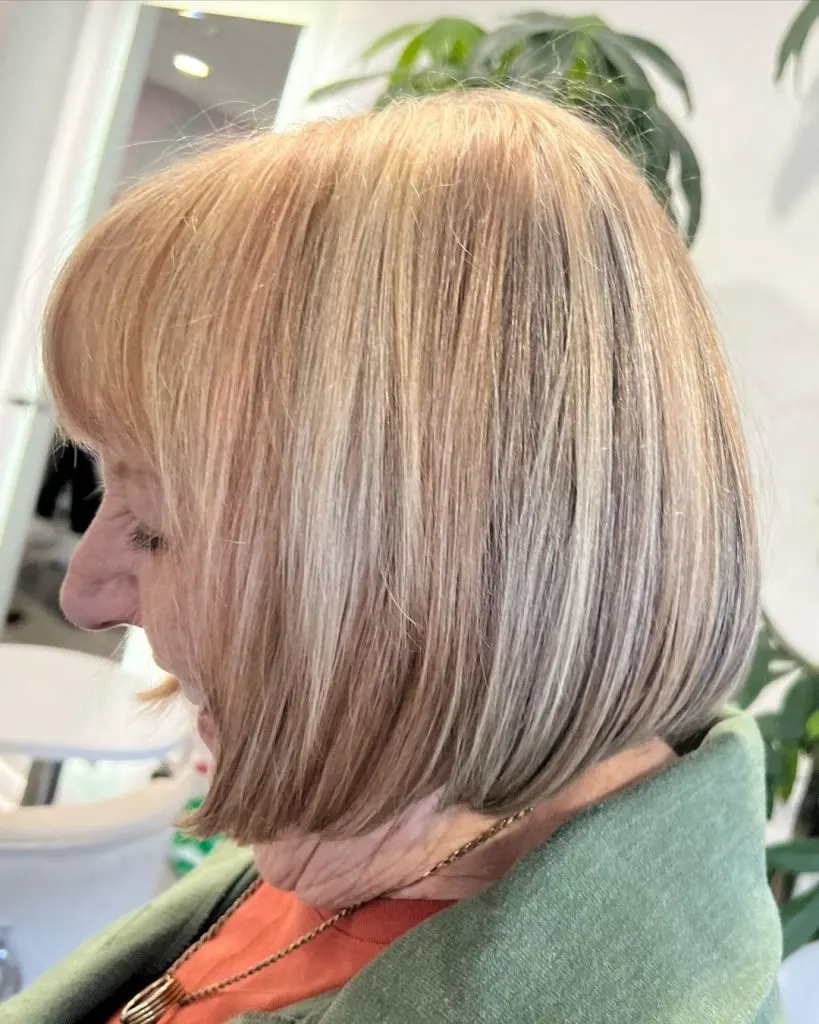 bob with bangs and highlights for women over 60