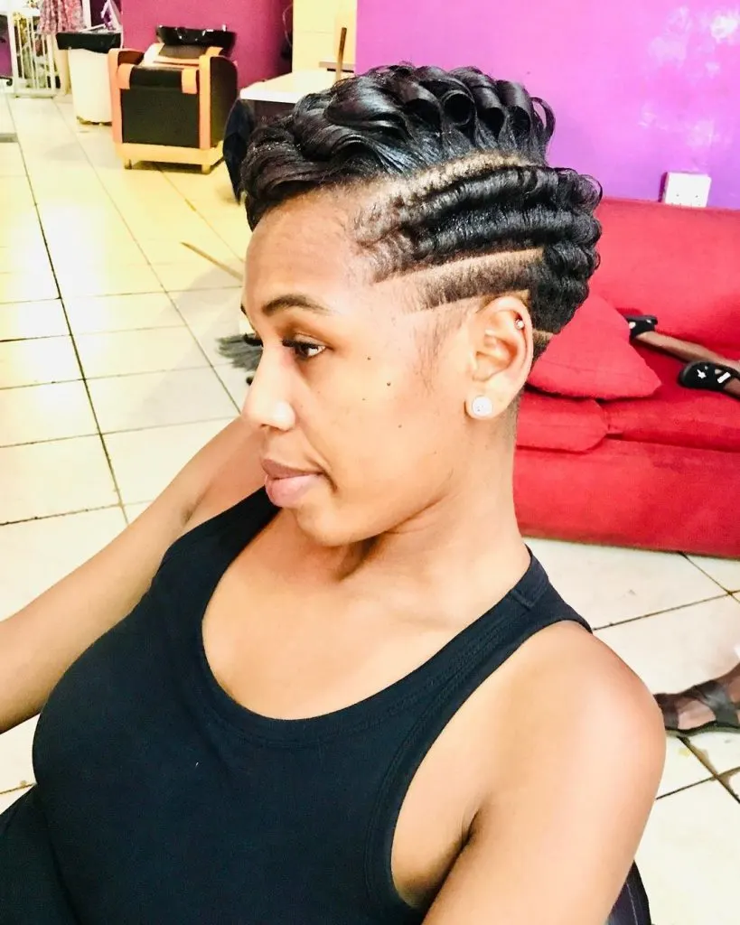 curly pixie cut with multiple fades