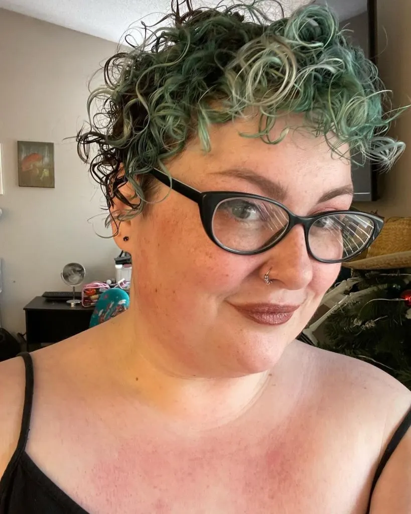 funky colored curly short haircut for women over 50