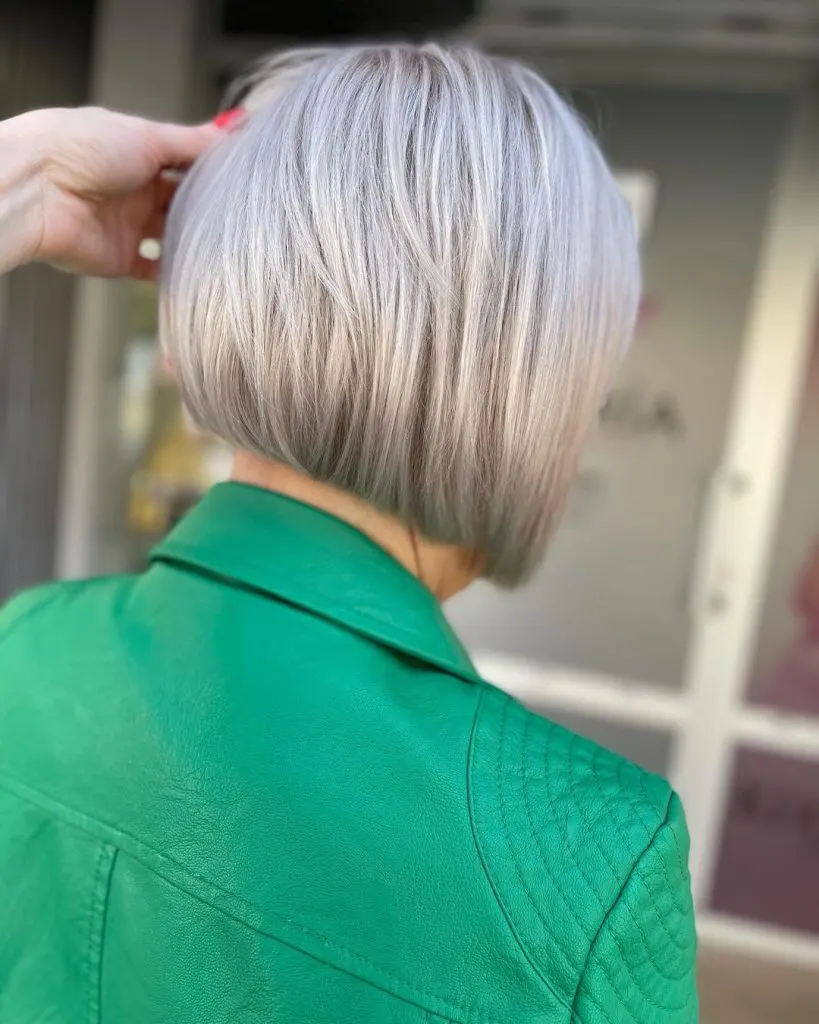 icy blonde one-length bob cut for women over 60