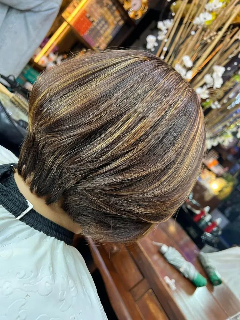 layered bob with highlights for women over 60