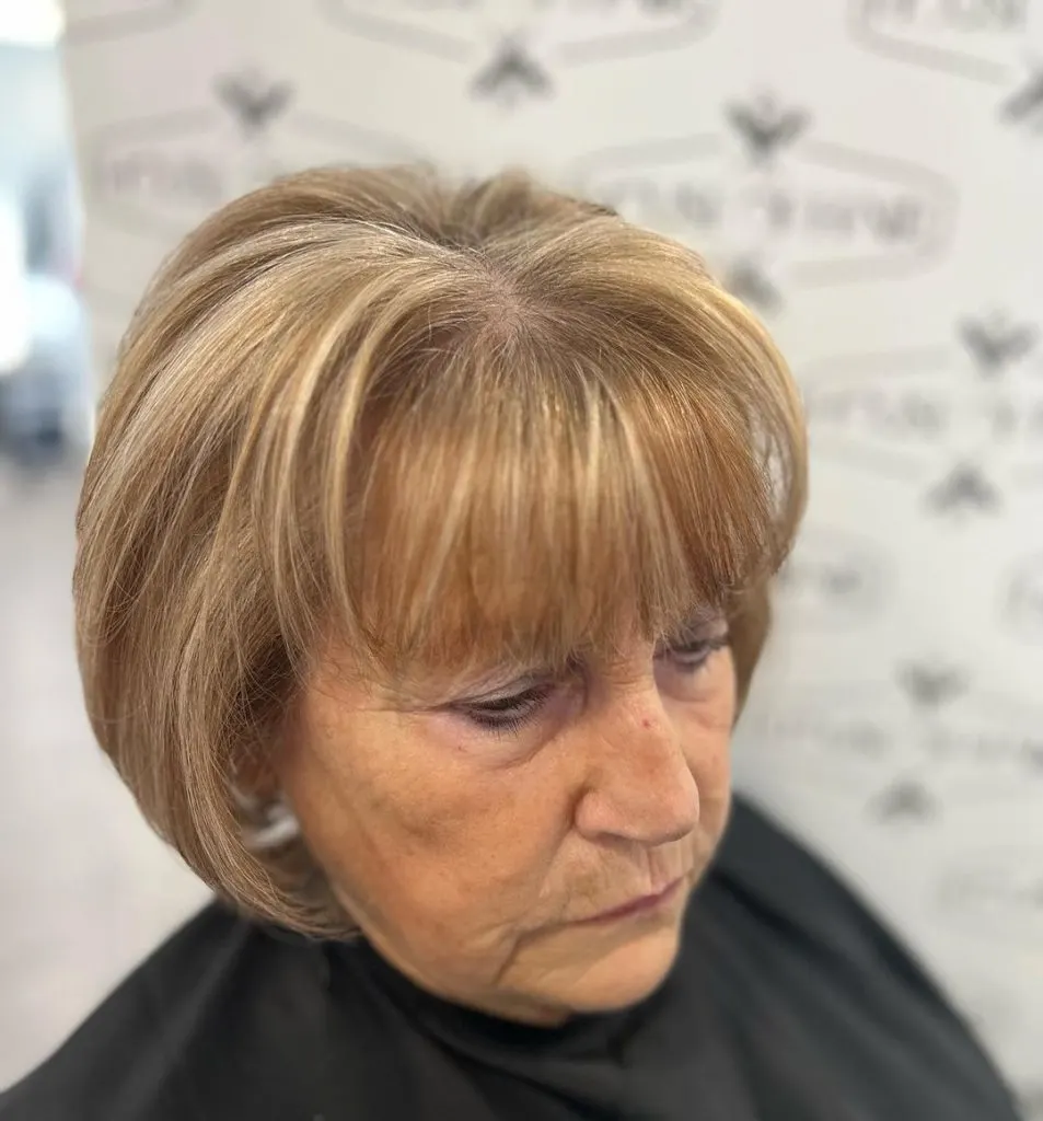 short haircut with round bangs for women over 60