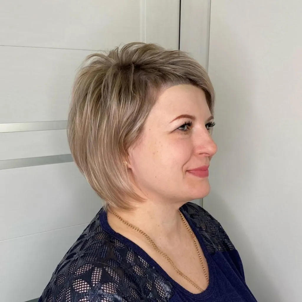 short hairstyle for women over 50 with round face