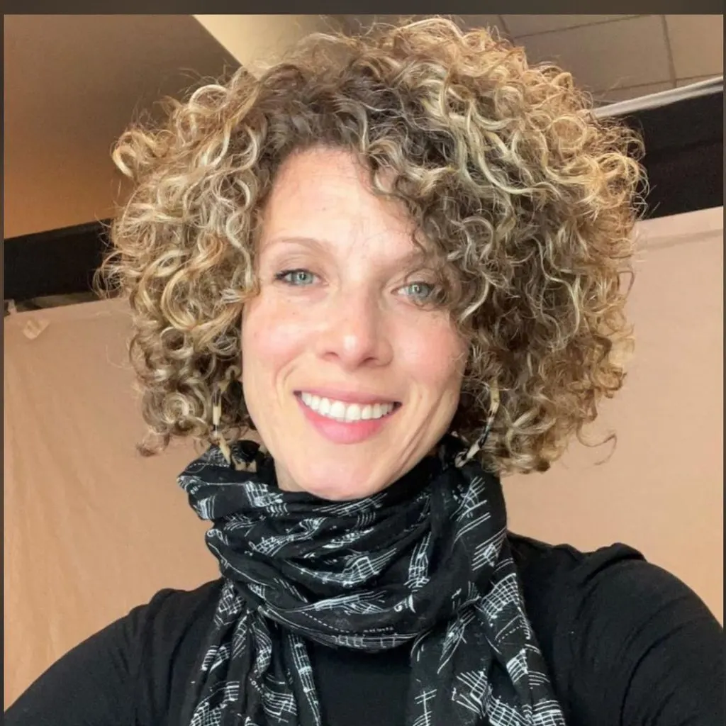 super thick curly short haircut for women over 50