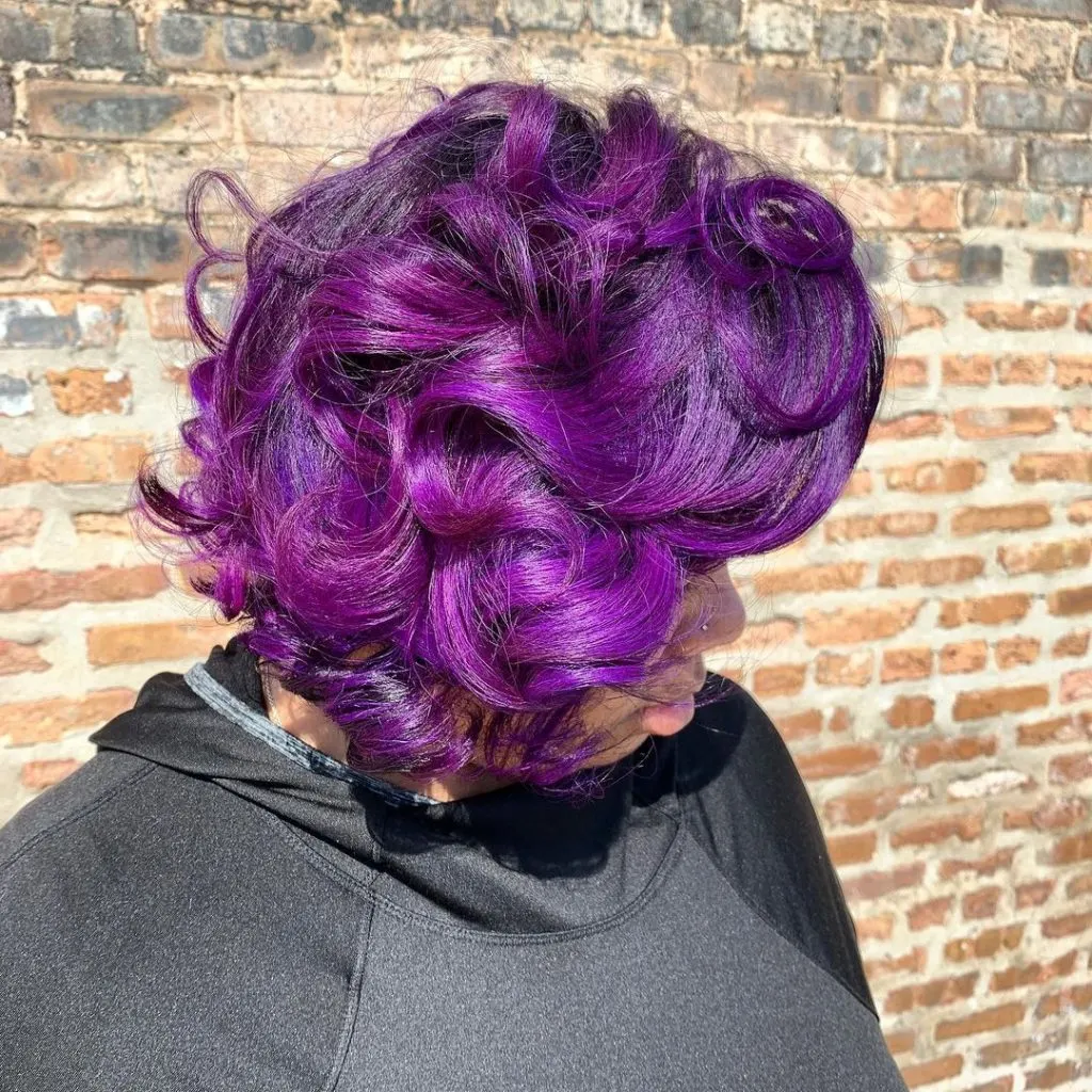 black woman with dark purple hair