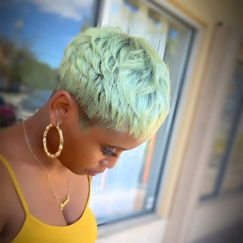 black woman with mint hair