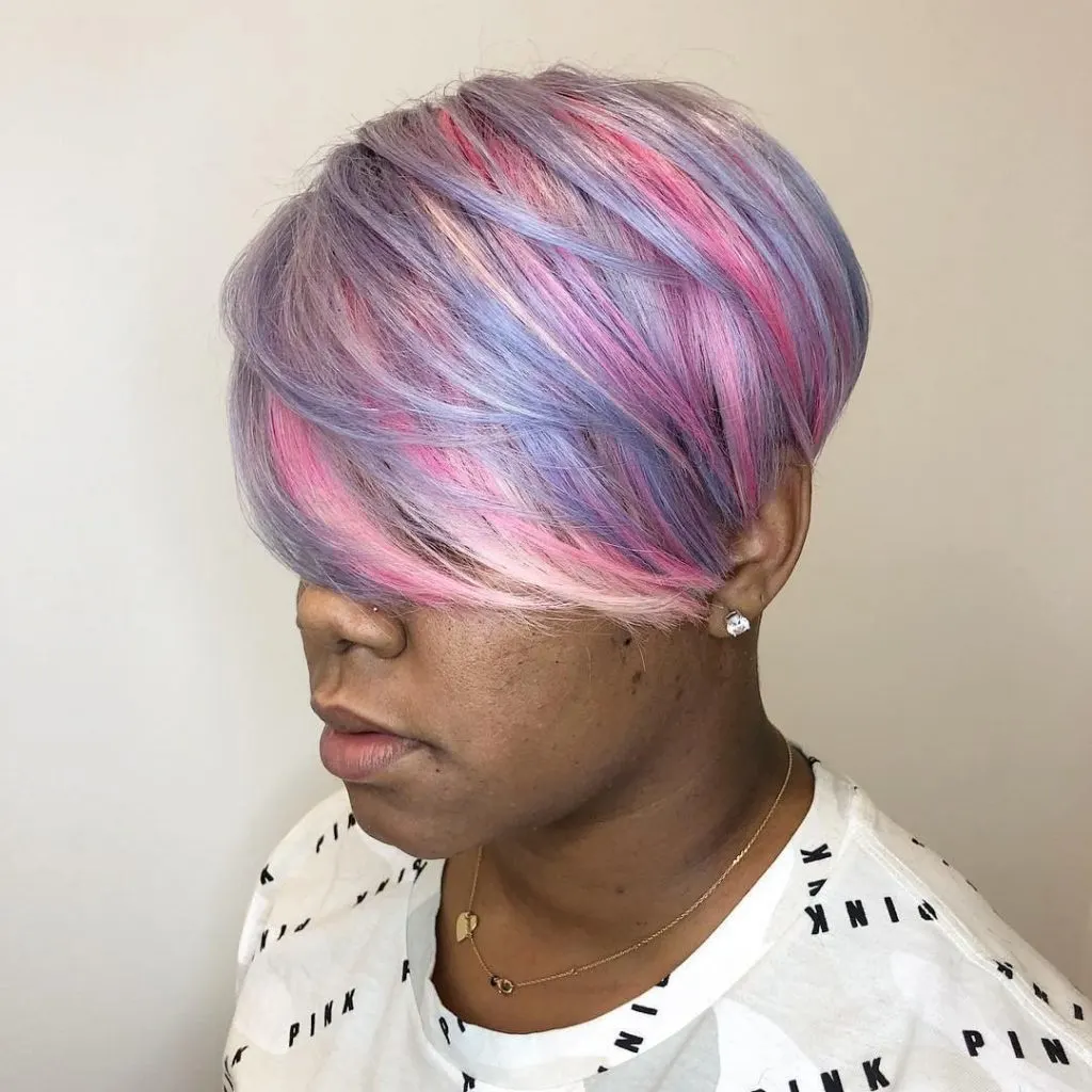 black woman with pastel blue and pink hair