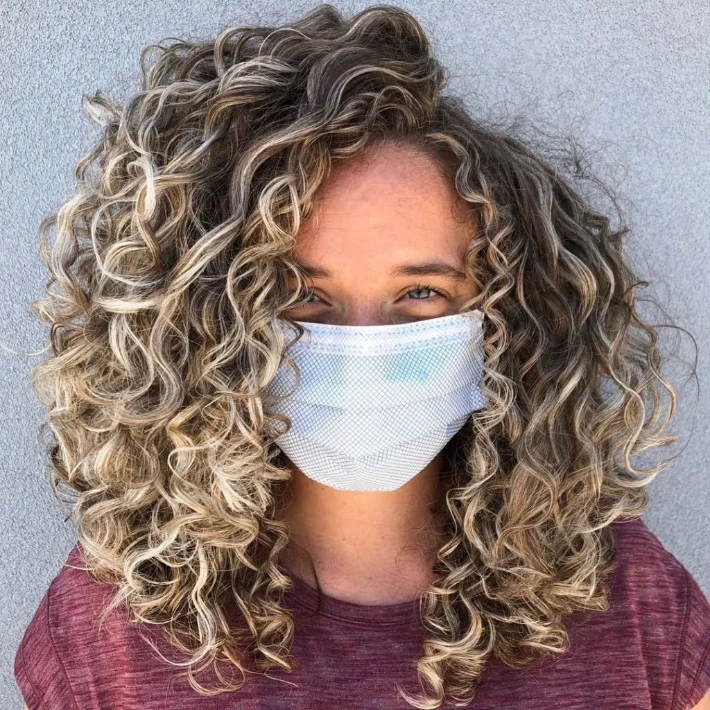 blonde balayage on naturally curly hair